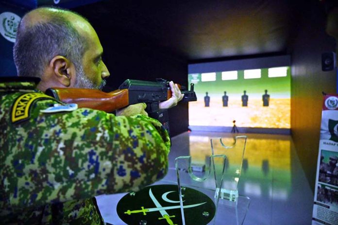 Army officer setting target in simulation stall of Research and Development Establishment (RDE) of Pakistan Army 2nd Edition of Pakistan International Maritime Expo and Conference 2025 at Expo Centre