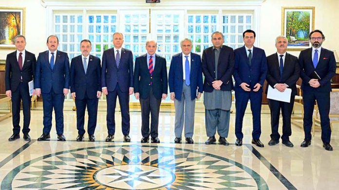 Prime Minister Muhammad Shehbaz Sharif in a group photo with the Turkish delegation led by Turkish Interior Minister Ali Yerlikaya