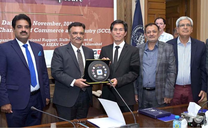 President SCCI, Syed Ehtsham Gilani, presents commemorative shields to members of the ASEAN Ambassador Delegation at SCCI