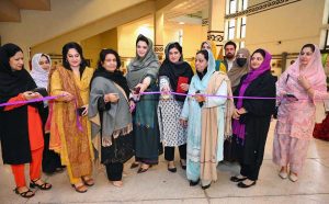 Mayor of Peshawar Zubair Ali and VC SBBWU Prof. Dr. Safia Ahmed (T.I), along with other officials and organizers, visit display stalls during the second day of the Dosti Peshawar Women Literature Festival 3rd Edition at City District College.