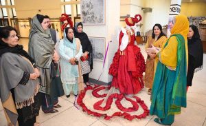 Mayor of Peshawar Zubair Ali and VC SBBWU Prof. Dr. Safia Ahmed (T.I), along with other officials and organizers, visit display stalls during the second day of the Dosti Peshawar Women Literature Festival 3rd Edition at City District College.