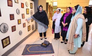 Mayor of Peshawar Zubair Ali and VC SBBWU Prof. Dr. Safia Ahmed (T.I), along with other officials and organizers, visit display stalls during the second day of the Dosti Peshawar Women Literature Festival 3rd Edition at City District College.