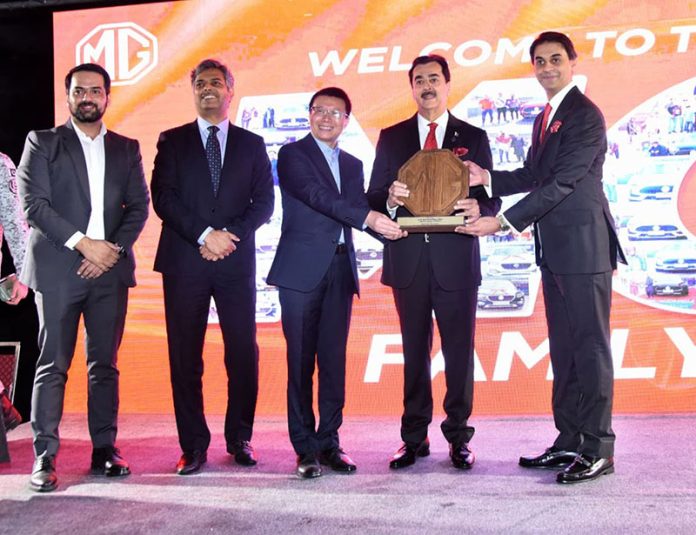 CEO of MG Motors presenting a souvenir to Acting President Syed Yousaf Raza Gilani at the inaugural ceremony of MG's flagship dealership
