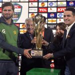 Pakistan’s Captain Shaheen Shah Afridi receives the trophy from Defence Minister Khawaja Muhammad Asif after the ODI series victory over Sri Lanka.