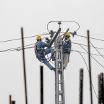 WAPDA workers installing new electrical wires at Kacheri Chowk