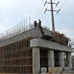Labourers busy in construction work of flyover at under construction 10th Avenue during development work in Federal Capital