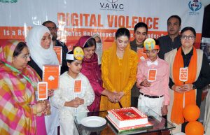 Chairperson Punjab Women Protection Authority, Hina Pervez Butt distributes shields among participants during a ceremony held in connection with the 16 Days of Activism campaign against violence toward women.