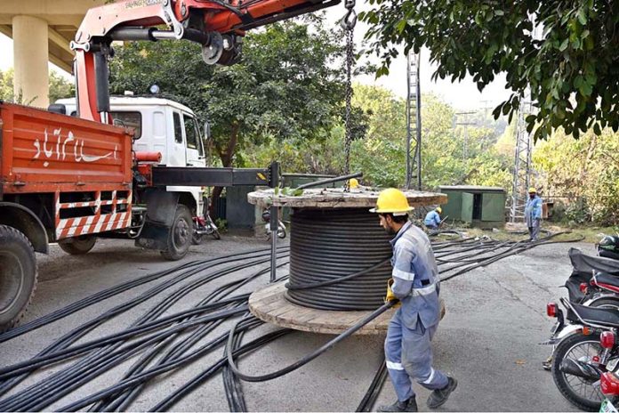 IESCO workers busy installing new electric wires in Federal Capital