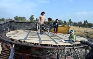 Children enjoy jumping on trampoline at I-9 area in the Federal Capital.