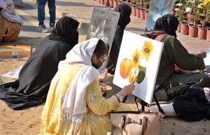 Students are busy painting in a competition during the 3-day Annual Chrysanthemum and Autumn Flower Show 2025 at the University of Agriculture Faisalabad (UAF).