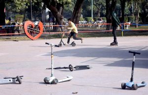 Laughter and excitement fill the historic Gulshan-e-Iqbal Park as children glide on skates and ride scotty scooters.