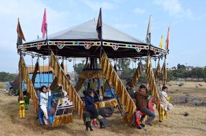 Children enjoy jumping on trampoline at I-9 area in the Federal Capital.