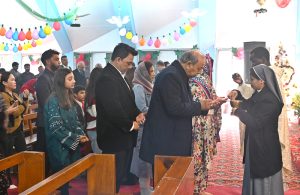 Christian community members performing religious rituals on Christmas day at Fatima Church.