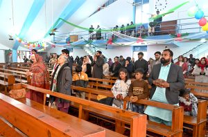 Christian community members performing religious rituals on Christmas day at Fatima Church.