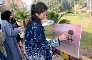 Students participate in a painting competition during the Art Gala exhibition at the Expo Centre, University of Agriculture Faisalabad.