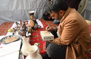 Artisans make and display their handmade decorative items at a stall during the second day of the Pakistan–Tajikistan Culture Festival Week at Lok Virsa.
