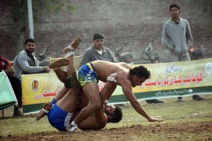 Players in action during the Kabaddi match between Bandesha Kabaddi Club and Ali Raza Wahla Kabaddi Club in the Gold Kabaddi Cup, organized by the Divisional Kabaddi Association and Divisional Sports Department at Al-Fateh Sports Ground.