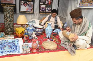 Artisans make and display their handmade decorative items at a stall during the second day of the Pakistan–Tajikistan Culture Festival Week at Lok Virsa.