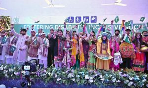 Minister of State for Federal Education and Professional Training, Ms. Wajiha Qamar, Parliamentary Secretary for the Ministry of Federal Education and Professional Training, Ms. Farah Naz Akbar and Federal Secretary Ministry of FE&PT Nadeem Mahbub pose for photograph with special children during a seminar on International Day of Persons with Disabilities 2025, Theme:"Fostering Disability-Inclusive Societies for Advancing Social Progress" at Rehabilitation Centre for Children with Developmental Disorders (RCCDD)