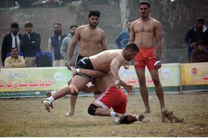 Players in action during the Kabaddi match between Bandesha Kabaddi Club and Ali Raza Wahla Kabaddi Club in the Gold Kabaddi Cup, organized by the Divisional Kabaddi Association and Divisional Sports Department at Al-Fateh Sports Ground.