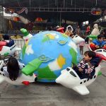 Children enjoy a swing during a fun fair for journalists’ families at Chacha Younas Park, arranged by the Press Club