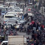 A road is blocked due to vehicles wrongly parked in a no-parking zone, disrupting traffic flow and pedestrian movement. Authorities are urged to take notice to prevent further inconvenience