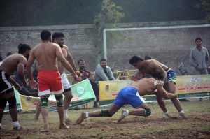 Players in action during the Kabaddi match between Bandesha Kabaddi Club and Ali Raza Wahla Kabaddi Club in the Gold Kabaddi Cup, organized by the Divisional Kabaddi Association and Divisional Sports Department at Al-Fateh Sports Ground.