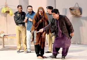 Artists perform in the drama “Maa (Mother)” during the Drama Festival at the Z.A. Bhutto Open Air Theatre, Arts Council.