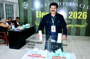 A journalist casts his vote during Election-2026 Hyderabad Press Club.