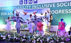 Minister of State for Federal Education and Professional Training, Ms. Wajiha Qamar, Parliamentary Secretary for the Ministry of Federal Education and Professional Training, Ms. Farah Naz Akbar and Federal Secretary Ministry of FE&PT Nadeem Mahbub pose for photograph with special children during a seminar on International Day of Persons with Disabilities 2025, Theme:"Fostering Disability-Inclusive Societies for Advancing Social Progress" at Rehabilitation Centre for Children with Developmental Disorders (RCCDD)