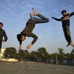 Youngsters leap and play with energy, creating striking silhouettes during the afternoon at G-6 in the Federal Capital