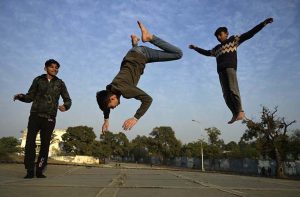 Youngsters leap and play with energy, creating striking silhouettes during the afternoon at G-6 in the Federal Capital