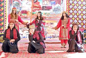 Students performing in a tableau during a function in connection with the upcoming Sindhi Ajrak Topi Culture Day at Government Girls Degree College.