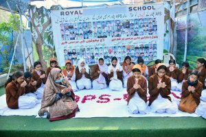 Students offering dua in commemoration of the martyrs of the 2014 Army Public School Peshawar terrorist attack at the Royal School System