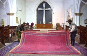 An illuminated view of St. John’s Church decorated with colourful lights in preparation for Christmas celebrations.