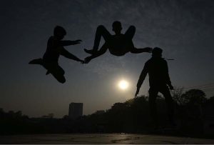 Youngsters leap and play with energy, creating striking silhouettes during the afternoon at G-6 in the Federal Capital