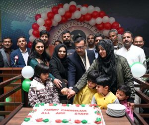Managing Director Associated Press of Pakistan Muhammad Asim Khichi cutting a Christmas cake with APP staff at the APP Headquarters.