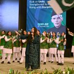 Artists with students performing national songs at a ceremony marking the birth anniversary of the Founder of Pakistan, Quaid-e-Azam Muhammad Ali Jinnah, at the Convention Centre.