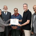 IVB Instructor Mr. Eric Aan distributes certificates among the participants at the Pakistan Volleyball Federation Closing Ceremony of the FIVB Coaches Training Program in Library Hall, Pakistan Sports Complex.