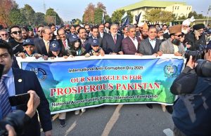 Speaker National Assembly Sardar Ayaz Sadiq and Chairman NAB Lt Gen (R) Nazir Ahmed lead an awareness walk with participants during an event marking International Anti-Corruption Day, organized by the NAB Islamabad–Rawalpindi at the Sports Complex.