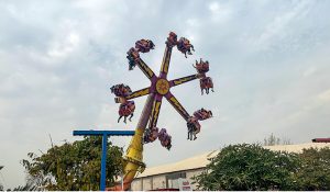Children enjoy a train ride at Lake View Park as golden sunlight breaks through clouds over the federal capital.