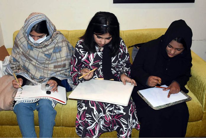 Girl art students practice for sketching during a workshop for expert art instructors and young artists at the Knowledge of Art Academy