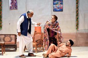 Artists performing in the drama “ Pato Pondaee Poe ( Pata Chale Ga Baad Mein) ” during Drama Festival at Z.A. Bhutto Open Air Theater, Arts Council.