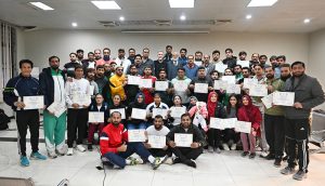 IVB Instructor Mr. Eric Aan distributes certificates among the participants at the Pakistan Volleyball Federation Closing Ceremony of the FIVB Coaches Training Program in Library Hall, Pakistan Sports Complex.