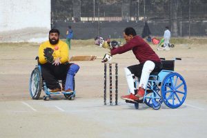 Special persons participate in an awareness walk at Kalma Chowk to mark the International Day of Persons with Disabilities