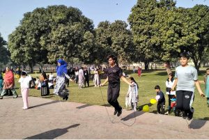 Children take part in a skipping activity during a recreational event at Shalimar Gardens as families enjoy a sunny winter day.