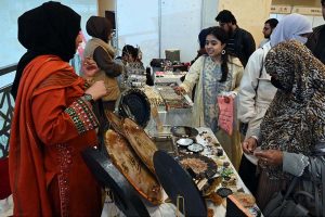 Visitors exploring stalls at IWCCI and APJCCI’s 7th Islamabad Expo 2025, celebrating innovation, business growth, and cultural exchange at the Pak-China Friendship Centre
