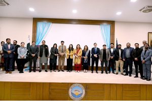 Sabeen Ghori, Parliamentary Secretary IT, presents a shield to Rana Imran Latif, Senior journalist, Anchorperson and chairman of Piyass International Human Rights, at the “Safe Her Growth” seminar at HITEC University Taxila.