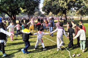 Children take part in a skipping activity during a recreational event at Shalimar Gardens as families enjoy a sunny winter day.