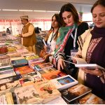 Women taking keen interest in books during the 18th World Urdu Conference at the Arts Council.